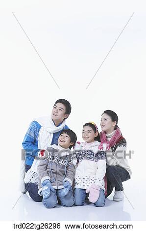 Stock Illustration - famliy kneel down in winter goods. Fotosearch