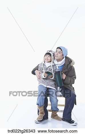 Drawing - father and son holding the tumbler. Fotosearch