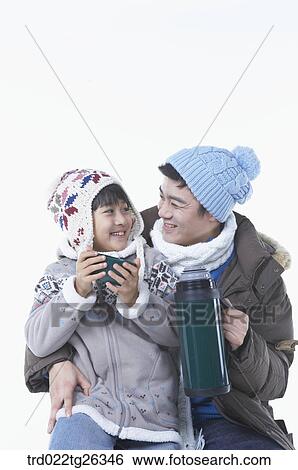 father and son holding the tumbler seeing each other View Large Illustration Stock Illustration - father and son holding the tumbler seeing each other. Fotosearch