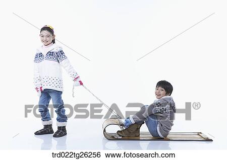 Stock Illustration - girl pulling the sled and boy sitting on . Fotosearch
