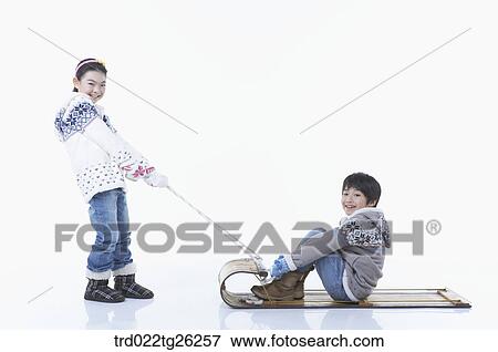 Stock Illustration - girl pulling the sled and boy sitting on . Fotosearch