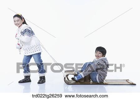 Stock Illustration - girl pulling the sled and boy sitting on . Fotosearch