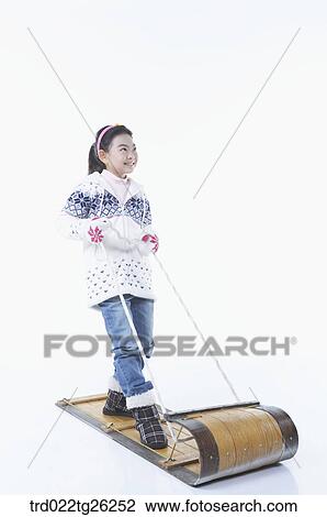Drawing - girl standing on the sled. Fotosearch