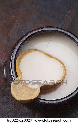 Stock Illustration - gourd cup and Korean traditional alcohol made from grain. Fotosearch