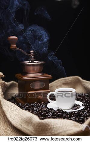 Drawing - grinder and coffee and roasted coffee beans in the sack. Fotosearch
