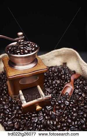 grinder and coffee beans with spoon in the sack View Large Illustration Stock Illustration - grinder and coffee beans with spoon in the sack. Fotosearch