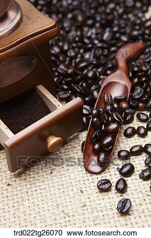 Clipart - grinder and roasted coffee beans with spoon. Fotosearch