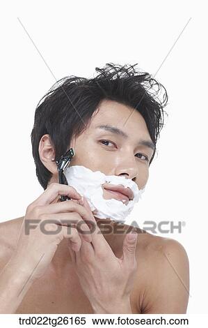 Stock Illustration - guy is shaving his face with razor. Fotosearch