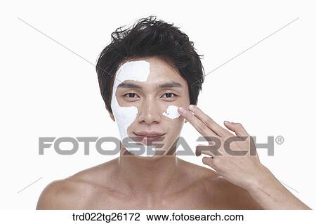 guy is spreading a face pack on his face View Large Illustration Drawing - guy is spreading a face pack on his face. Fotosearch