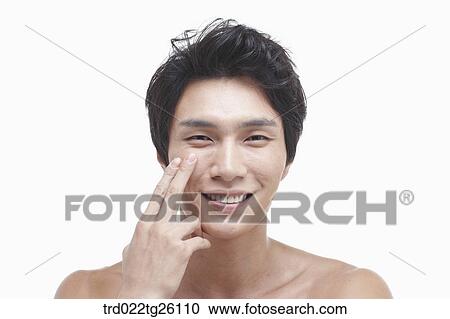Clipart - guy touchung his chin. Fotosearch