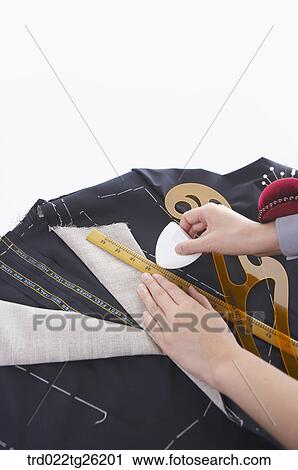 hands chalking on the fabric View Large Illustration Clip Art - hands chalking on the fabric. Fotosearch