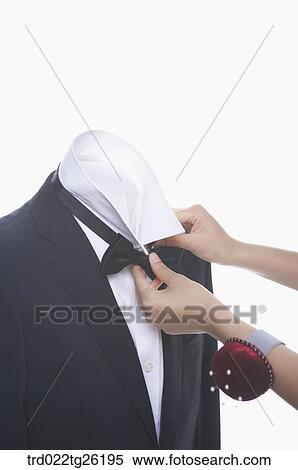 Stock Illustration - hands wearing the bow tie. Fotosearch