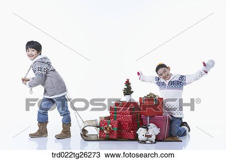 happy boy and girl with a christmas presents View Large Illustration Drawing - happy boy and girl with a christmas presents. Fotosearch