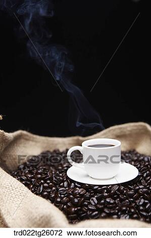 Drawing - hot coffee and roasted coffee beans. Fotosearch