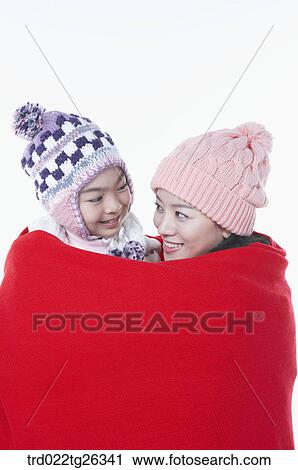 mother and daughter is covering with the red blanket View Large Illustration Clip Art - mother and daughter is covering with the red blanket. Fotosearch