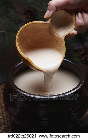 Clip Art - pouring Korean traditional alcohol made from grain. Fotosearch