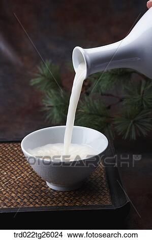 Stock Illustration - pouring Korean traditional alcohol made from grain. Fotosearch