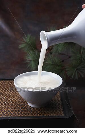 Stock Illustration - pouring Korean traditional alcohol made from grain. Fotosearch