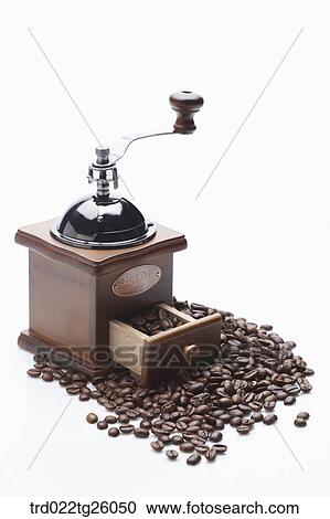 Clipart - roasted coffee beans and grinder. Fotosearch