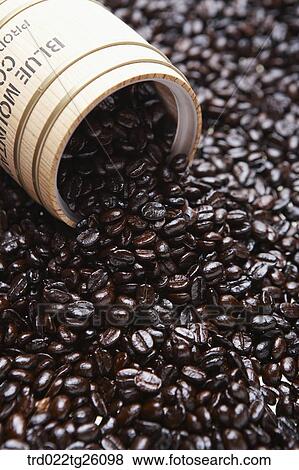 Stock Illustration - roasted coffee beans poured out from the container. Fotosearch