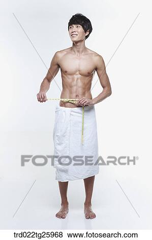 Stock Illustration - topless guy measuring waist. Fotosearch