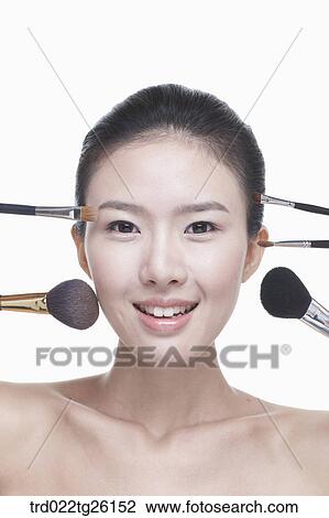 Drawing - woman and makeup brushes. Fotosearch