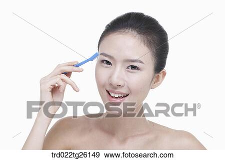 Stock Illustration - woman and makeup tool. Fotosearch