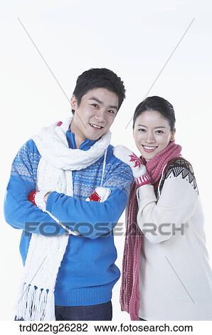 Drawing - woman and man is wearing winter goods. Fotosearch