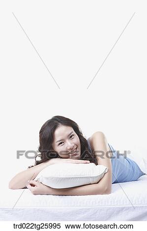 Stock Illustration - woman lay down with a pillow. Fotosearch