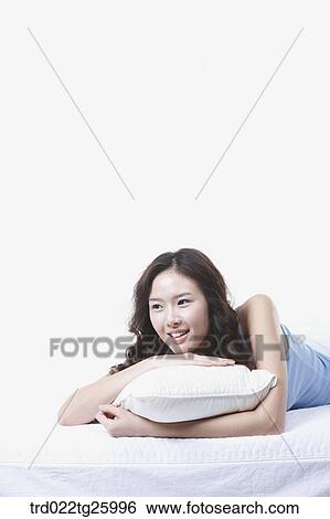 woman lay down with a pillow View Large Illustration Stock Illustration - woman lay down with a pillow. Fotosearch