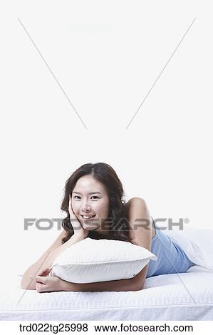 Stock Illustration - woman lay down with a pillow. Fotosearch
