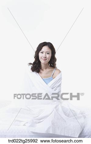 woman sitting and wrapped towel View Large Illustration Drawing - woman sitting and wrapped towel. Fotosearch