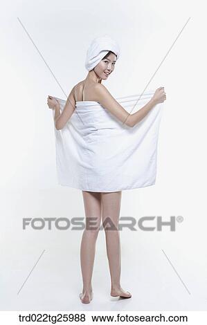 Stock Illustration - woman spreads out the towel. Fotosearch