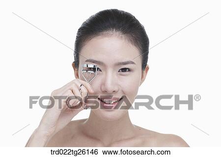Stock Illustration - woman wearing makeup. Fotosearch