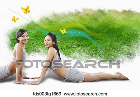Stock Illustration - women exercising yoga together. Fotosearch