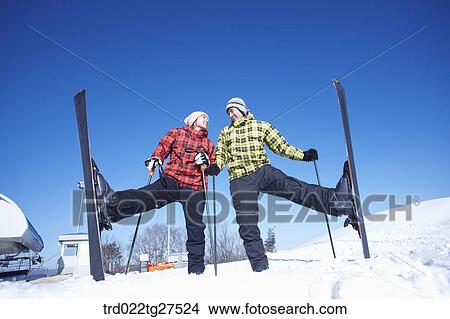 Picture - cordial couple having fun in ski resort. Fotosearch