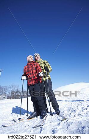 cordial couple having fun in ski resort View Large Photo Image Stock Image - cordial couple having fun in ski resort. Fotosearch