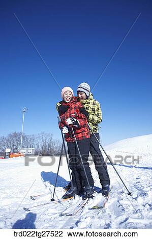 Stock Image - cordial couple having fun in ski resort. Fotosearch