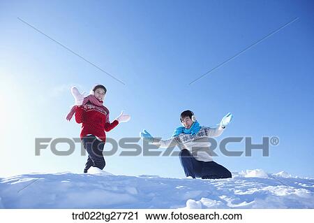 cordial couple having fun in ski resort with big smile View Large Photo Image Stock Image - cordial couple having fun in ski resort with big smile. Fotosearch