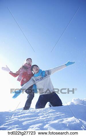 cordial couple having fun in ski resort with big smile View Large Photo Image Stock Image - cordial couple having fun in ski resort with big smile. Fotosearch