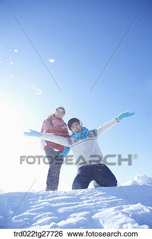 cordial couple having fun in ski resort with big smile View Large Photo Image Stock Photograph - cordial couple having fun in ski resort with big smile. Fotosearch