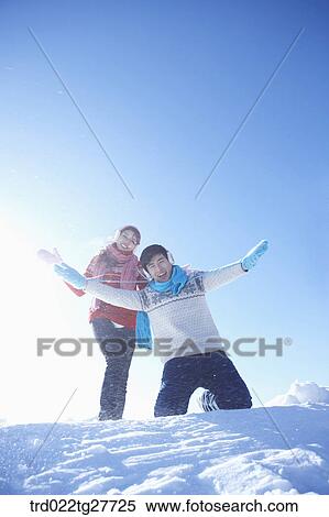 cordial couple having fun in ski resort with big smile View Large Photo Image Stock Photography - cordial couple having fun in ski resort with big smile. Fotosearch