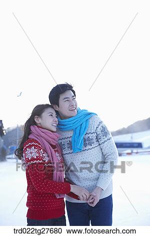 cordial couple holding hands in same clothing View Large Photo Image Stock Image - cordial couple holding hands in same clothing. Fotosearch