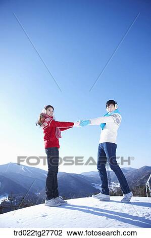 cordial couple holding hands together View Large Photo Image Stock Image - cordial couple holding hands together. Fotosearch