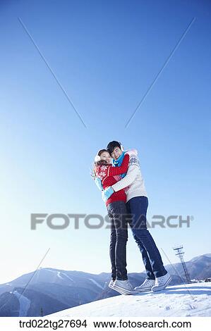 Picture - cordial couple hugging. Fotosearch