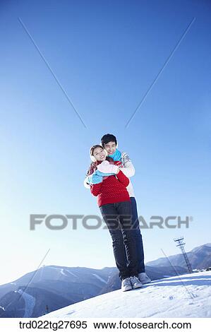 Stock Photography - cordial couple hugging. Fotosearch