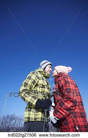 Stock Photograph - cordial couple in ski resort. Fotosearch