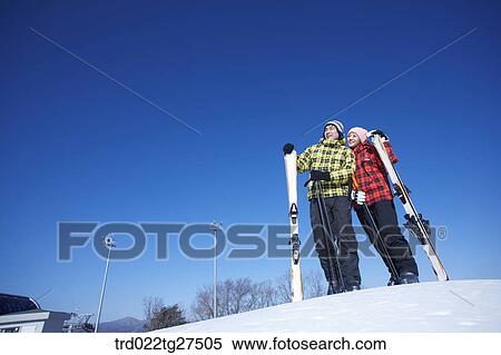 Stock Photography - couple enjoy skiing. Fotosearch