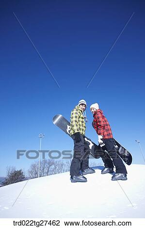 couple enjoying snow board View Large Photo Image Stock Image - couple enjoying snow board. Fotosearch