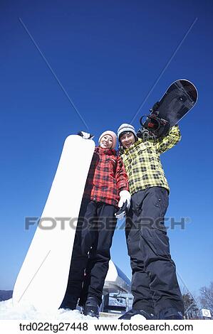 couple enjoying snow board View Large Photo Image Stock Photo - couple enjoying snow board. Fotosearch